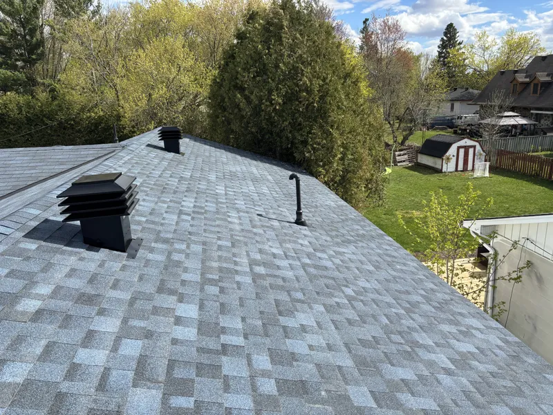Finished asphalt shingle roof on a Rockland-area home