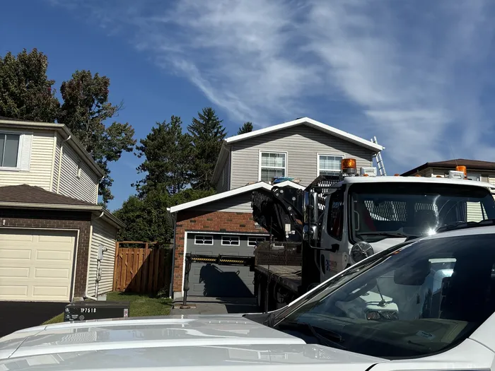 Meagher's Roofing work truck on a residential job site